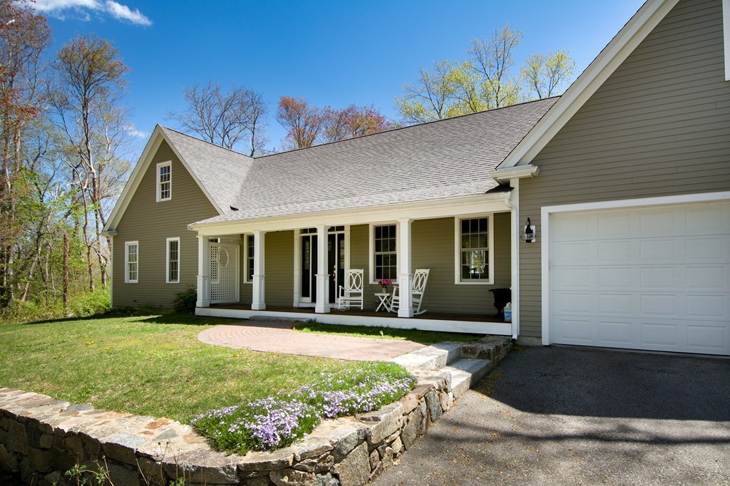 158 First Parish Road Scituate, MA 02066 - Photo 3 of 27 a front view of a house with a garden and yard