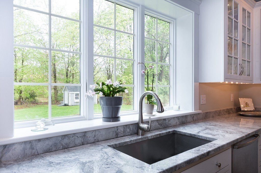 158 First Parish Road Scituate, MA 02066 - Photo 6 of 27 a white kitchen with a sink and large window