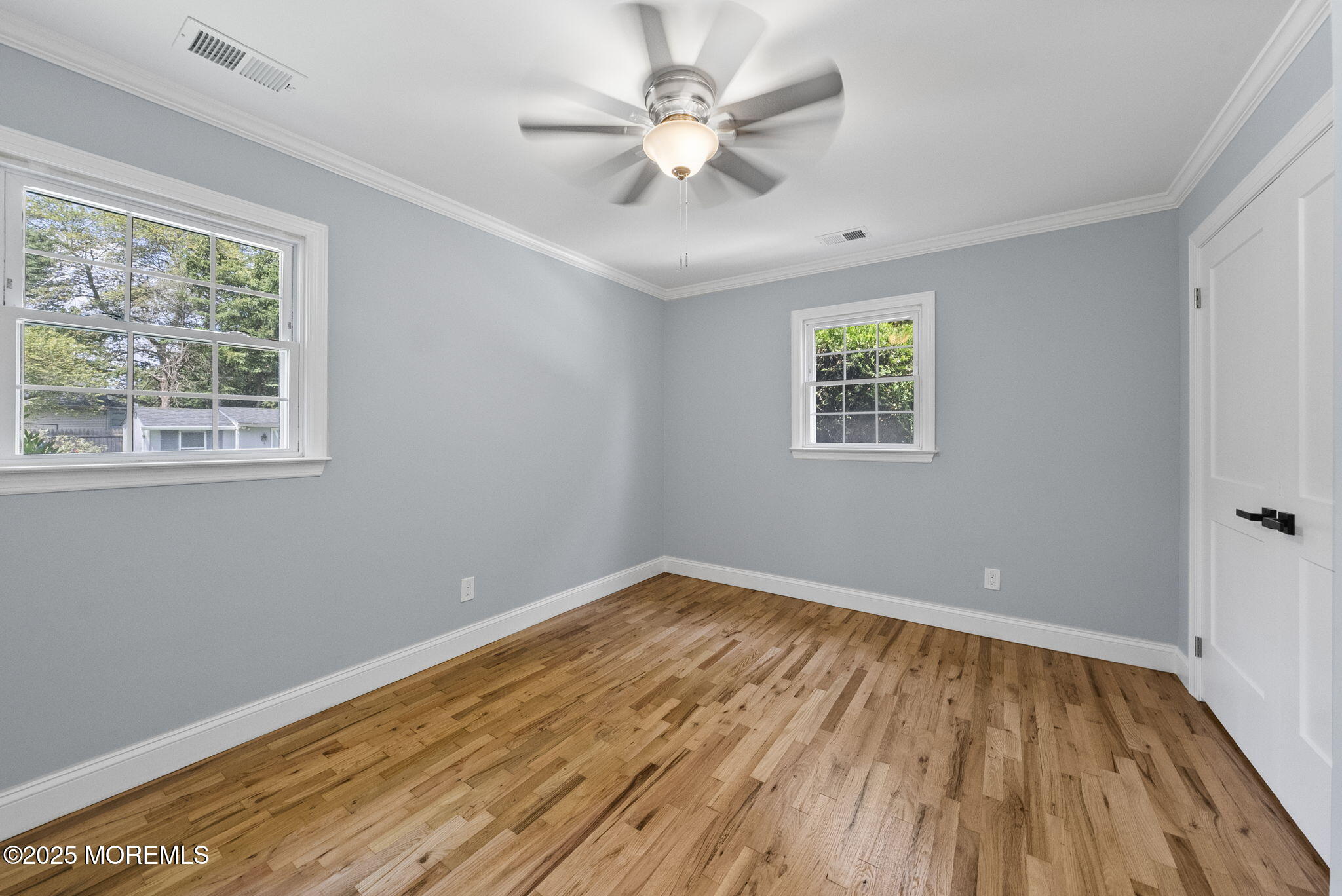 34 Traymore Road Freehold, NJ 07728 - Photo 23 of 23 wooden floor in an empty room with a window