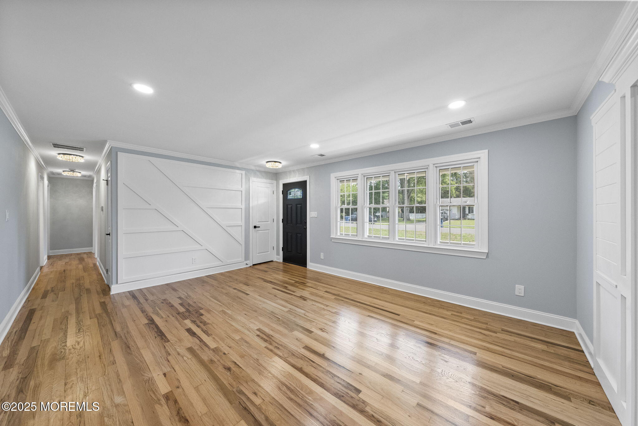 34 Traymore Road Freehold, NJ 07728 - Photo 5 of 23 a view of empty room with wooden floor and fan