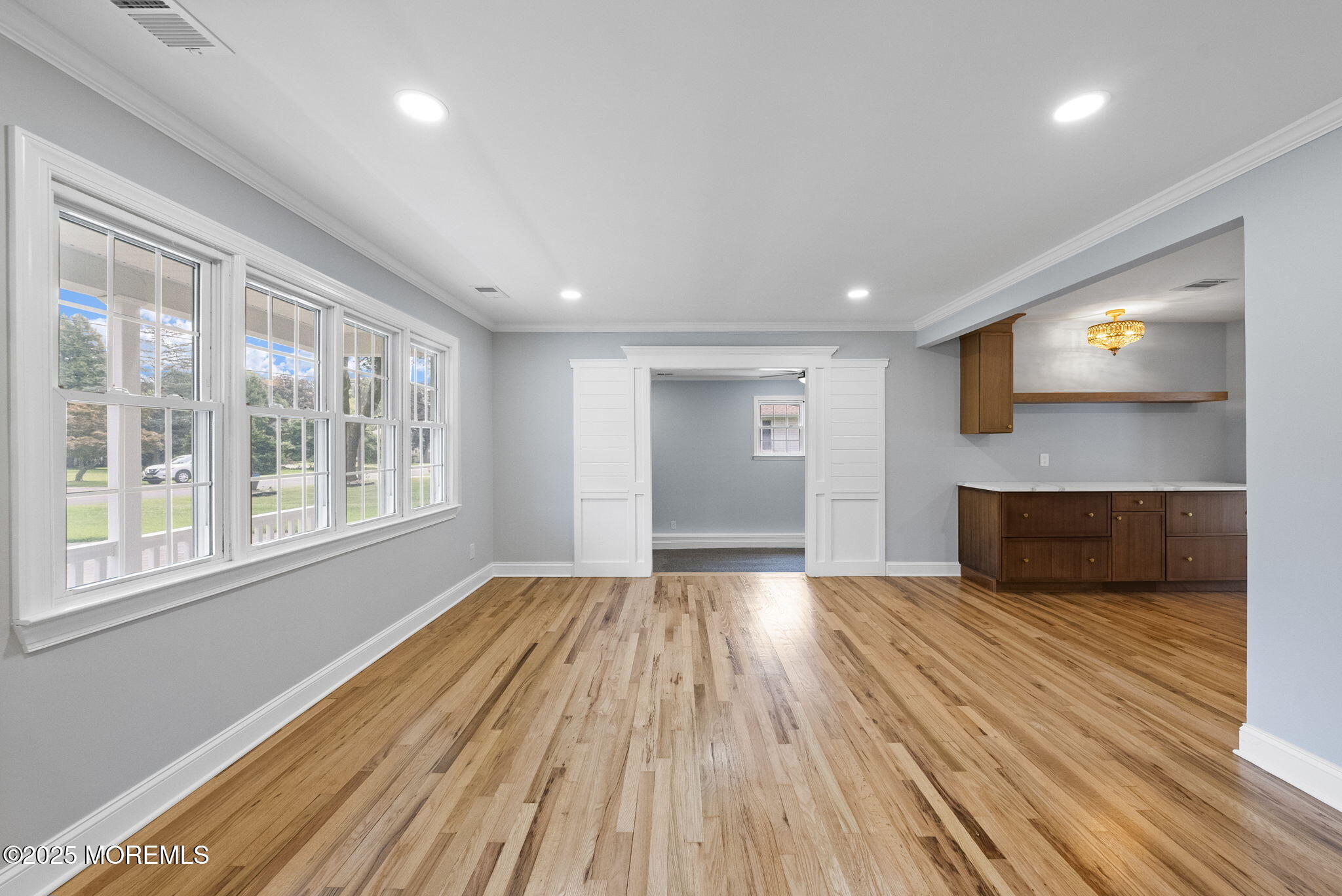 34 Traymore Road Freehold, NJ 07728 - Photo 6 of 23 a view of empty room with wooden floor and fan