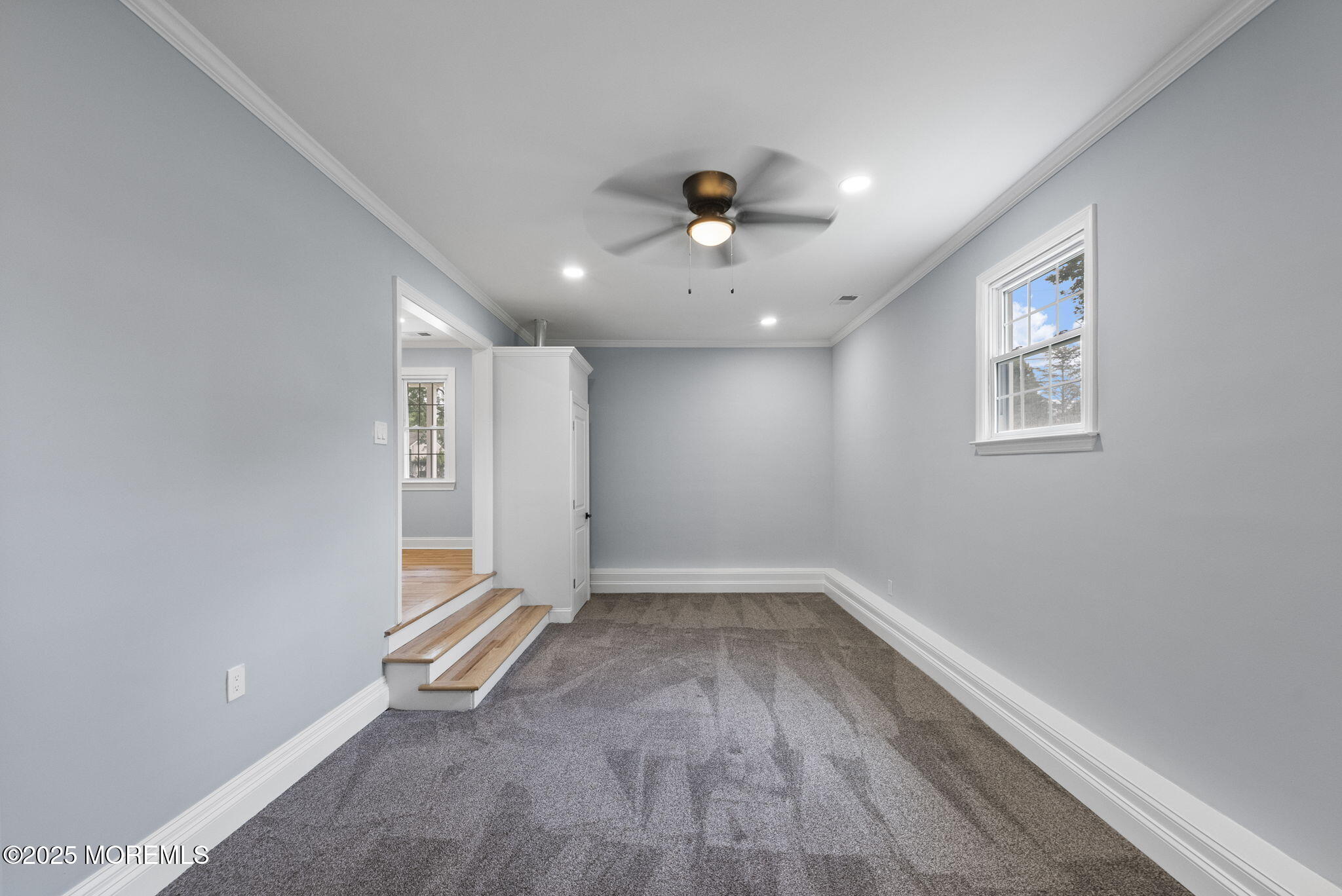 34 Traymore Road Freehold, NJ 07728 - Photo 8 of 23 wooden floor in an empty room with a window