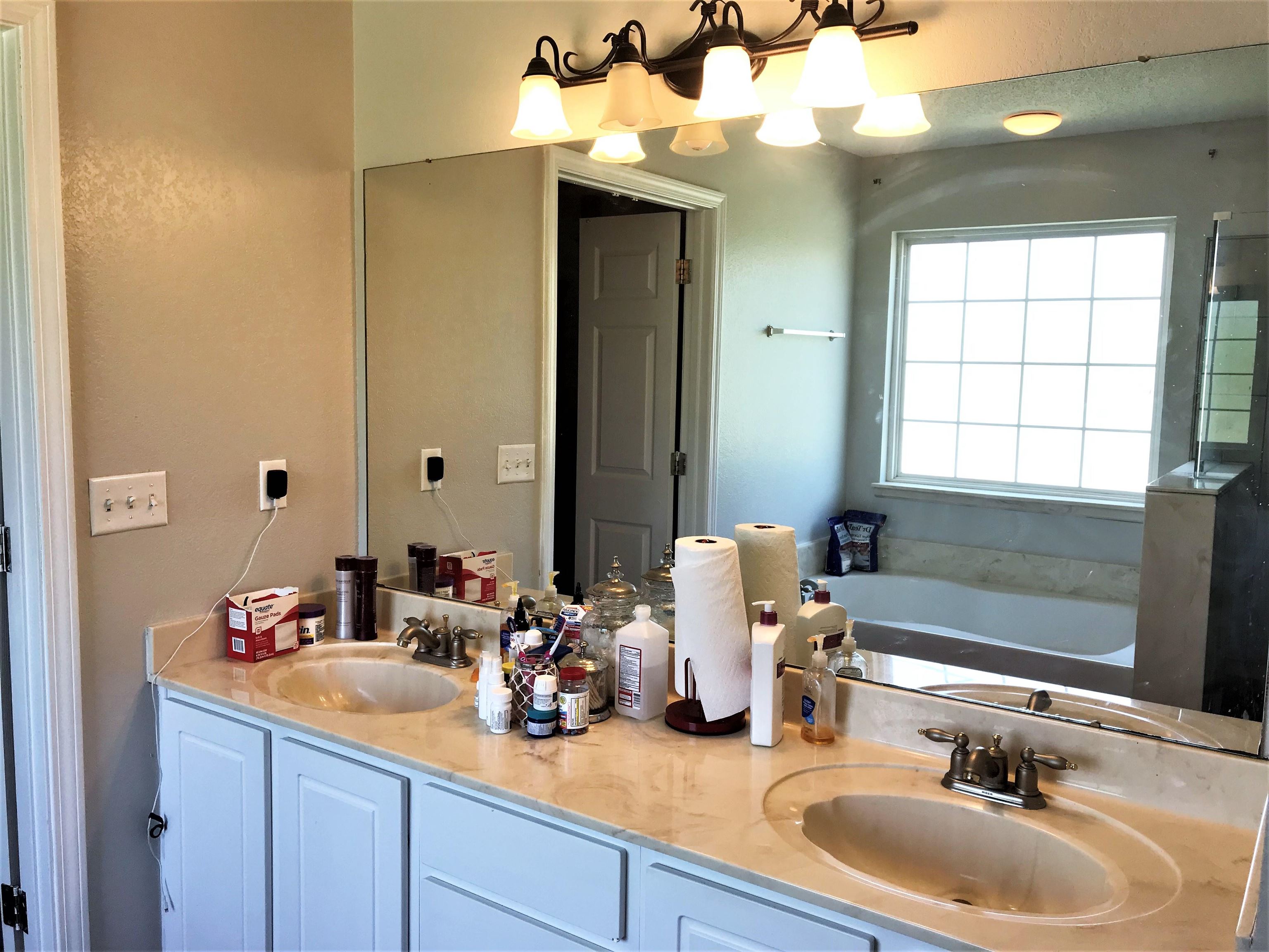 871 Ruby Creek Cove Memphis, TN 38109 - Photo 12 of 16 a bathroom with a sink and a mirror
