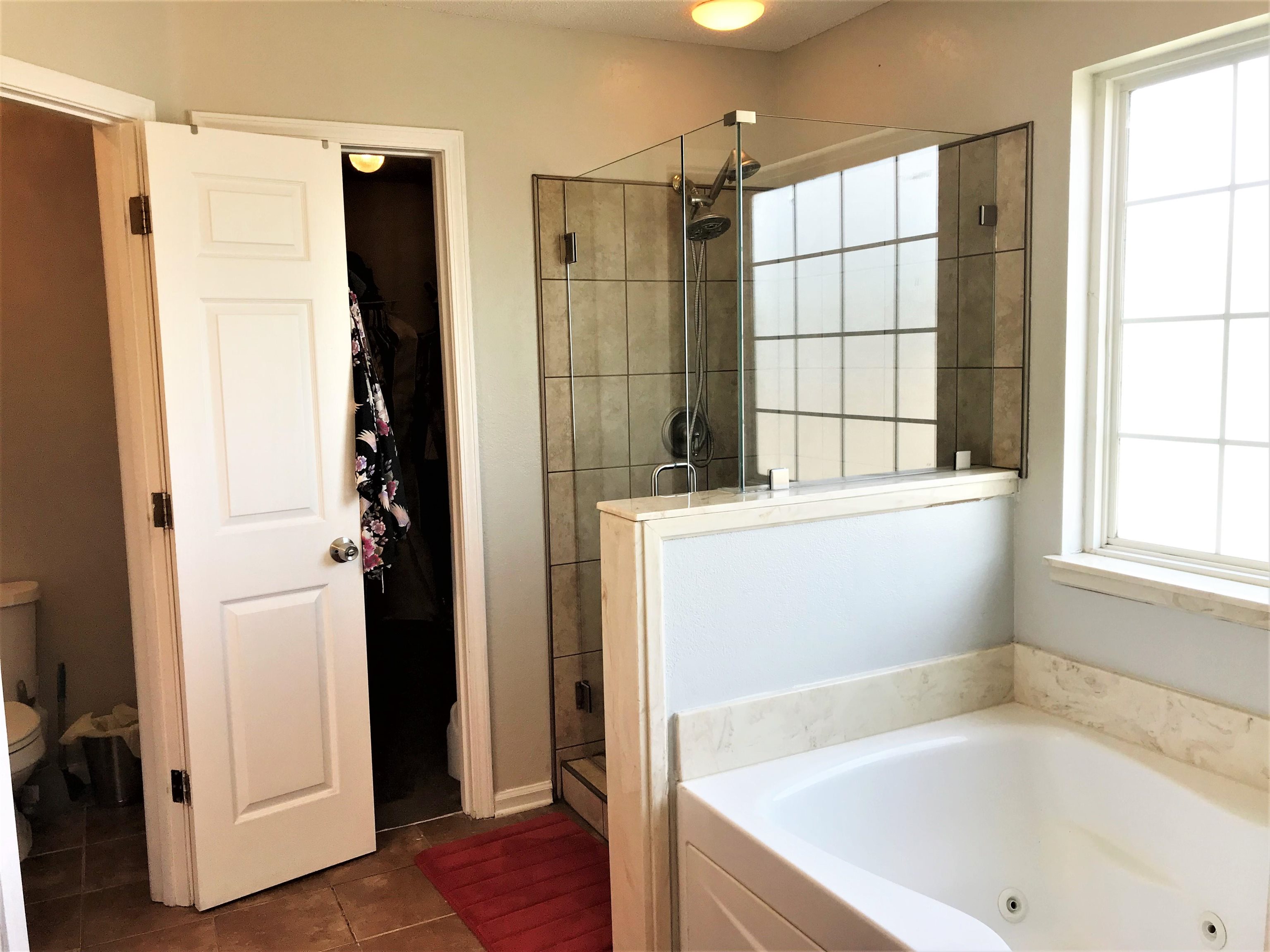 871 Ruby Creek Cove Memphis, TN 38109 - Photo 13 of 16 a bathroom with a bathtub and a shower
