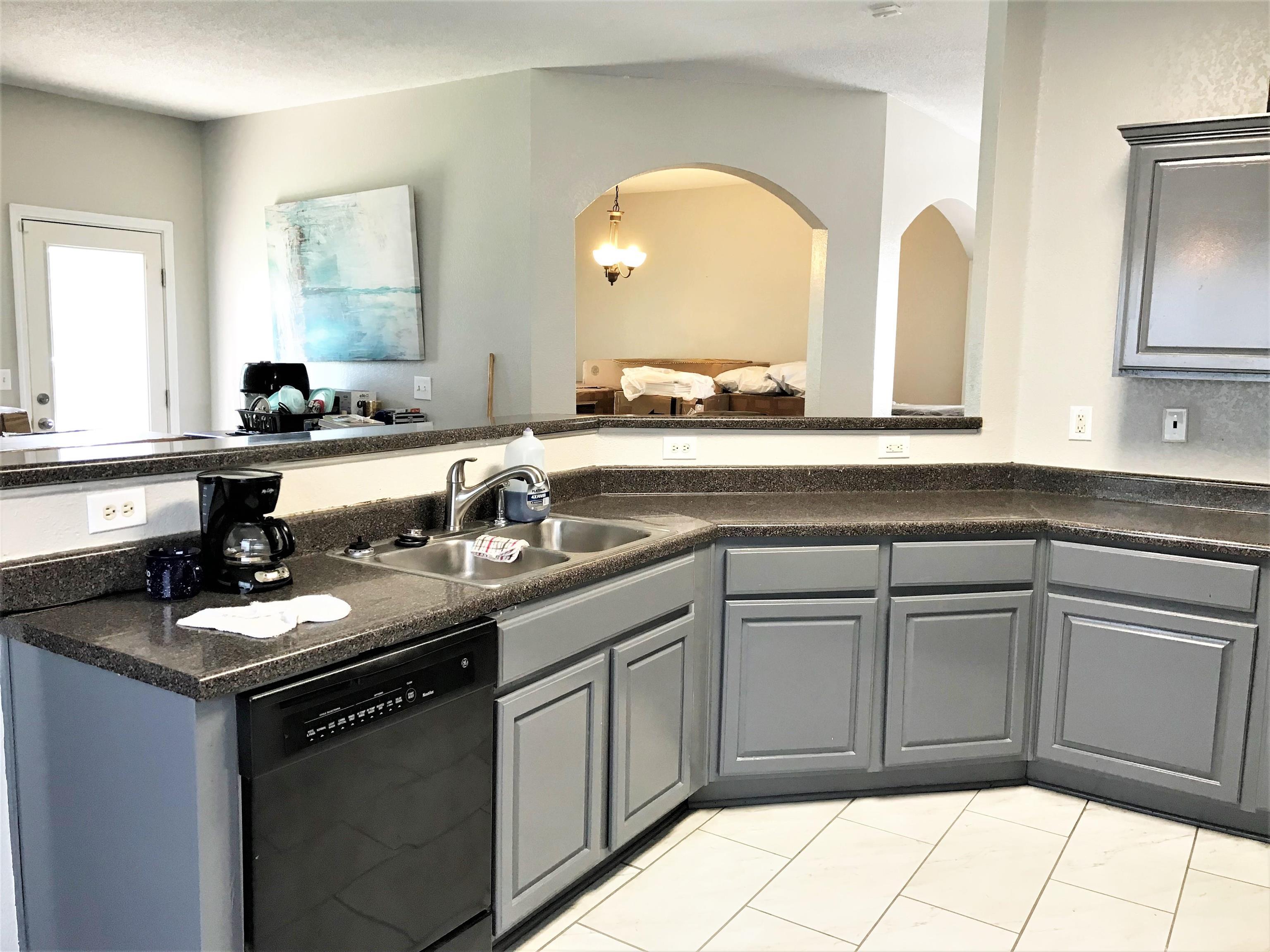 871 Ruby Creek Cove Memphis, TN 38109 - Photo 5 of 16 a kitchen with a sink and cabinets