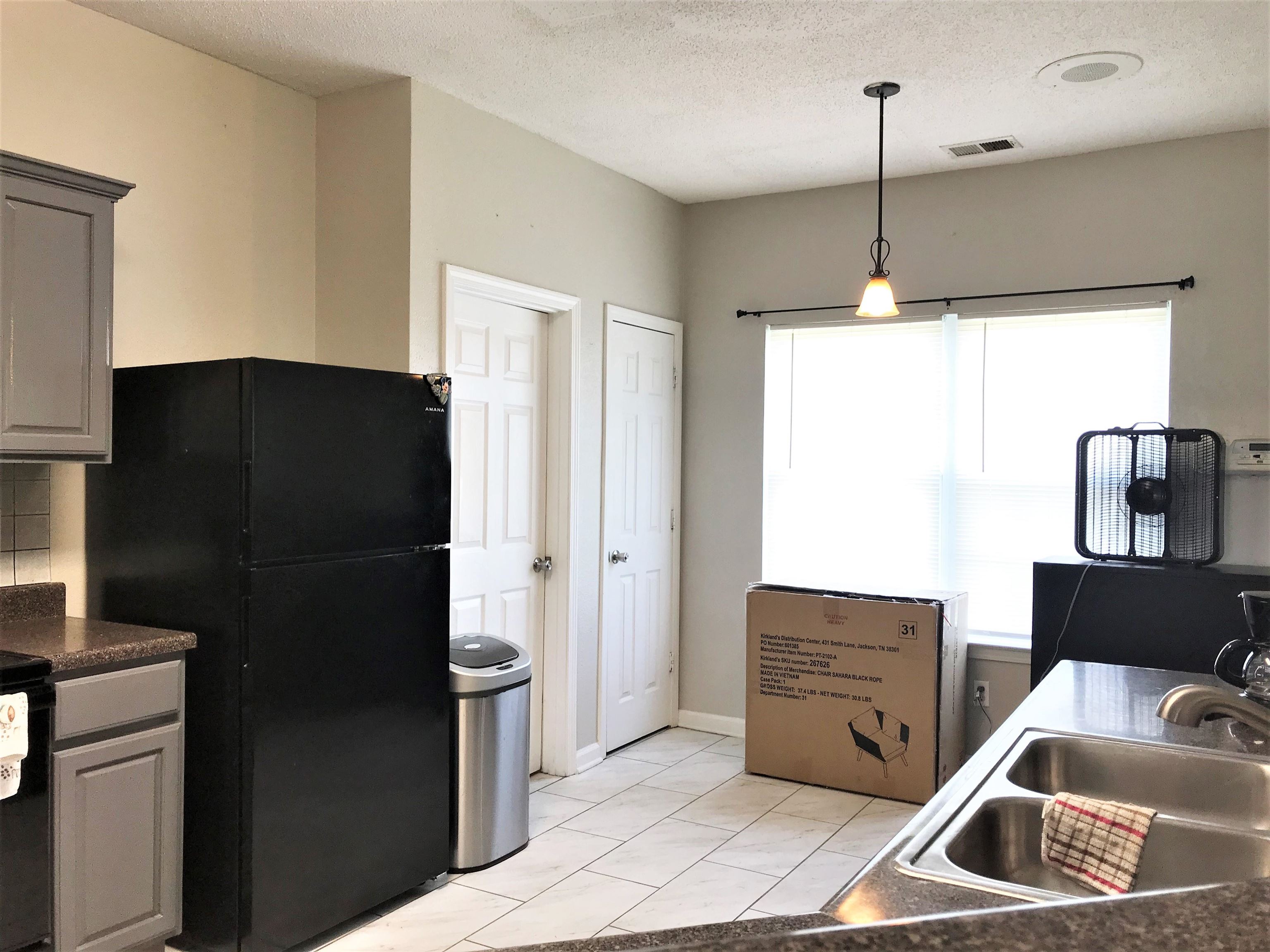 871 Ruby Creek Cove Memphis, TN 38109 - Photo 6 of 16 a kitchen with stainless steel appliances granite countertop a refrigerator and a sink