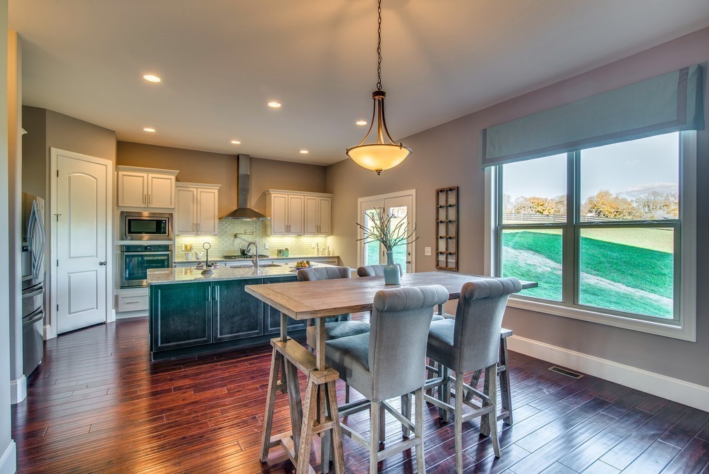 1026 October Park Way Franklin, TN 37067 - Photo 11 of 27 a view of a dining room with furniture window and wooden floor