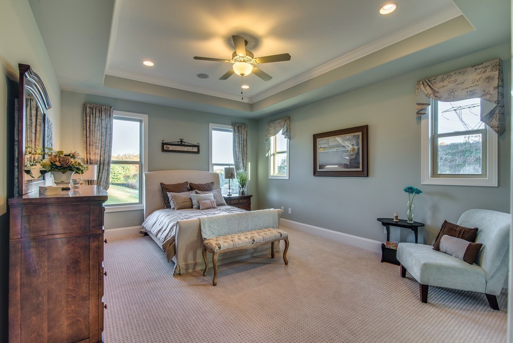 1026 October Park Way Franklin, TN 37067 - Photo 15 of 27 a bedroom with a bed couch and window