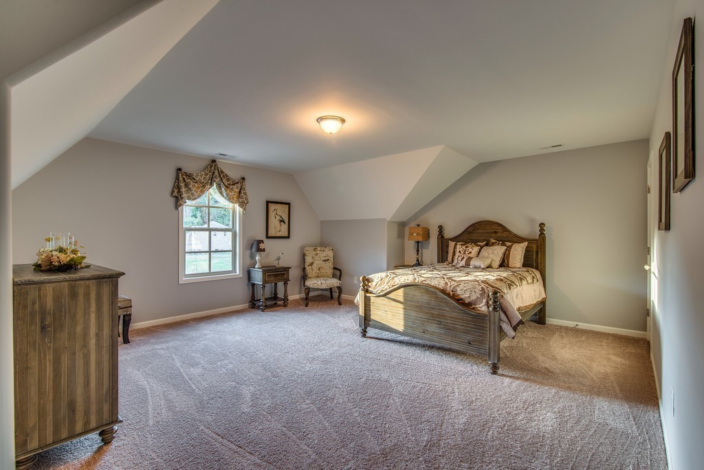 1026 October Park Way Franklin, TN 37067 - Photo 22 of 27 a bedroom with a bed and a window