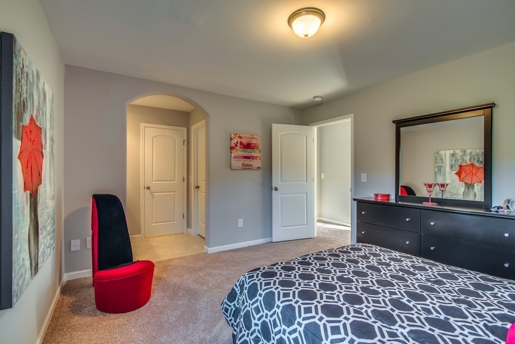 1026 October Park Way Franklin, TN 37067 - Photo 24 of 27 a bed room with a bed and a television