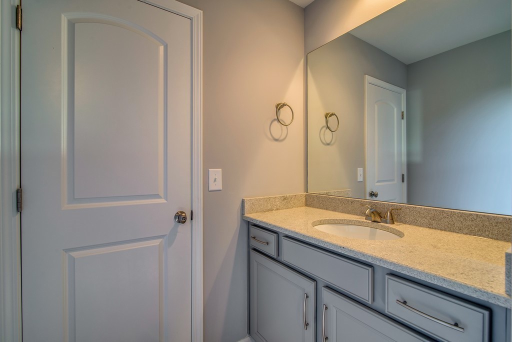 1026 October Park Way Franklin, TN 37067 - Photo 27 of 27 a bathroom with a sink and a mirror
