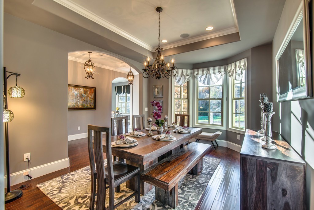 1026 October Park Way Franklin, TN 37067 - Photo 7 of 27 a view of a dining room with furniture wooden floor and chandelier