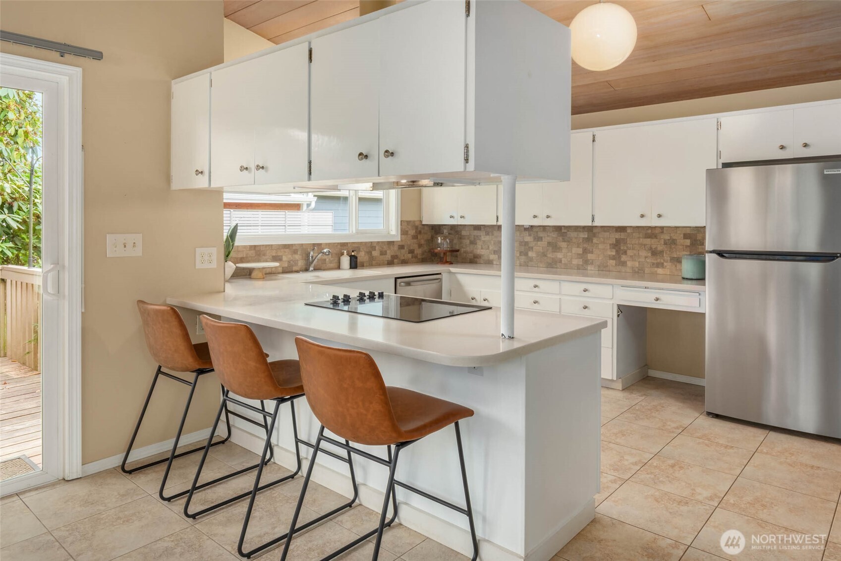 618 Riverview Drive Monroe, WA 98272 - Photo 11 of 39 a kitchen with stainless steel appliances granite countertop a stove a sink refrigerator and white cabinets with wooden floor