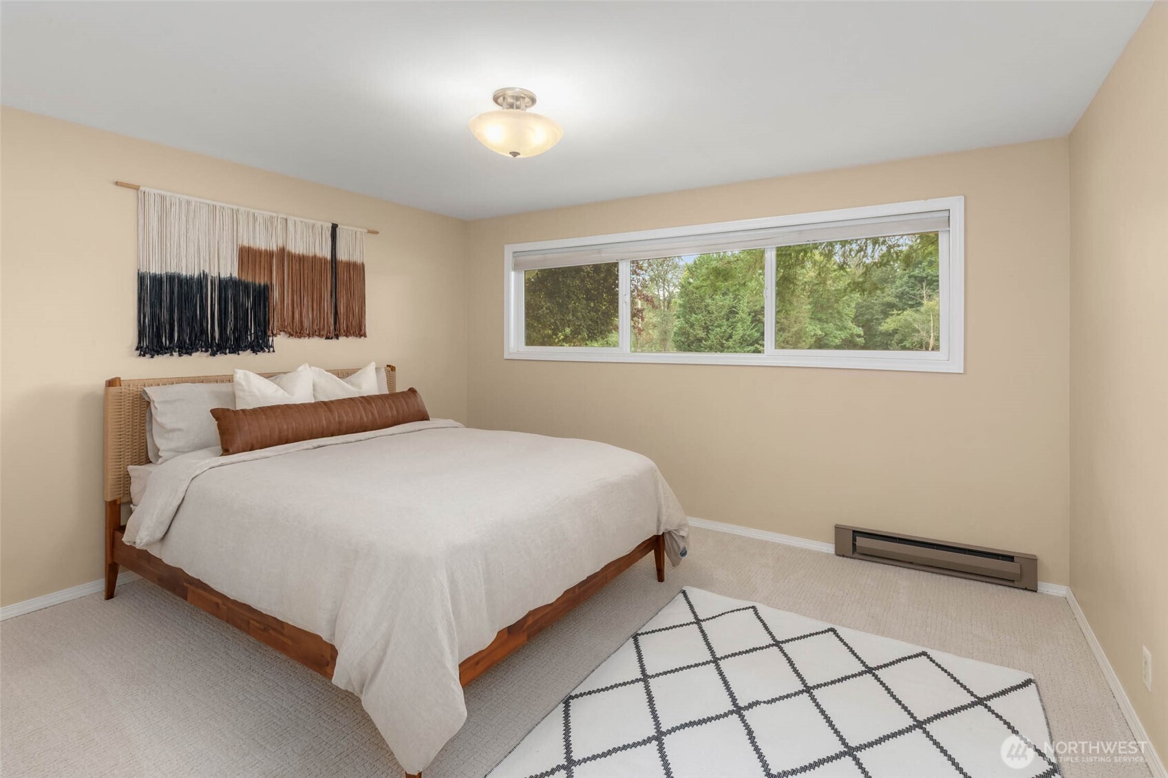 618 Riverview Drive Monroe, WA 98272 - Photo 16 of 39 a bedroom with a bed and a flat screen tv