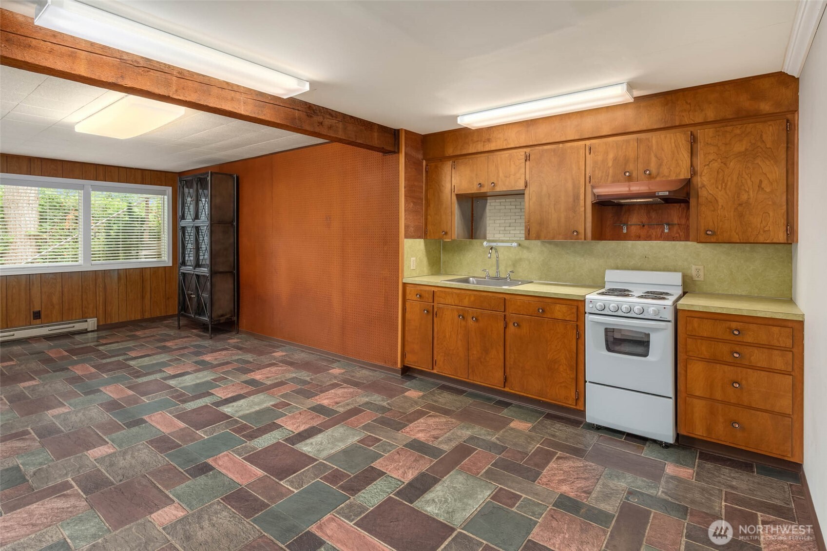 618 Riverview Drive Monroe, WA 98272 - Photo 22 of 39 a kitchen with a stove sink and cabinets