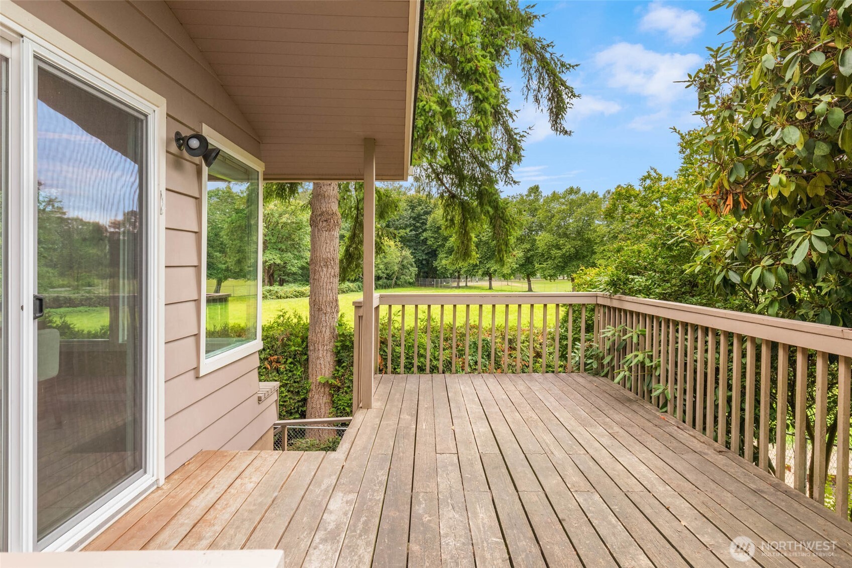 618 Riverview Drive Monroe, WA 98272 - Photo 29 of 39 a view of a two chairs with wooden floor and outdoor space