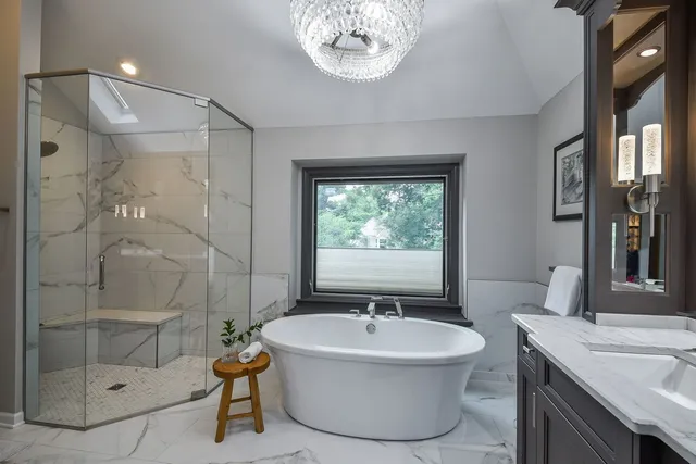 a bathroom with a sink a bathtub and a shower
