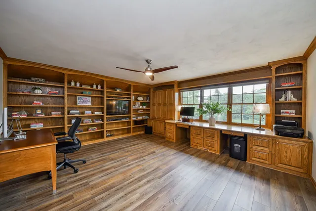 a view of a livingroom with furniture and a large window