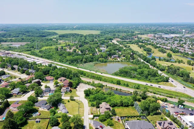 an aerial view of a house with yard