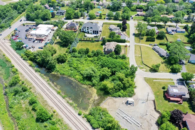 a view of a garden with a building in the background