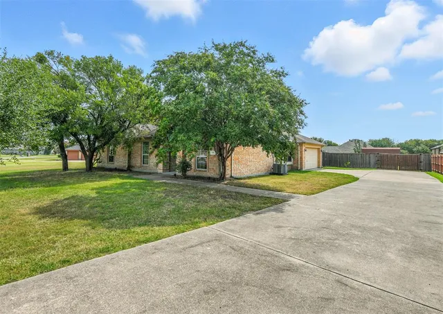 a view of a park with large trees