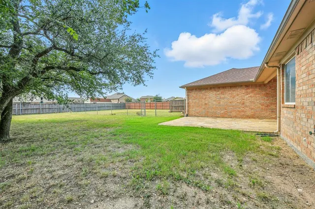 a view of a back yard of the house