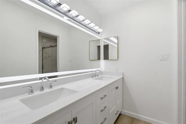 a bathroom with a sink and a mirror