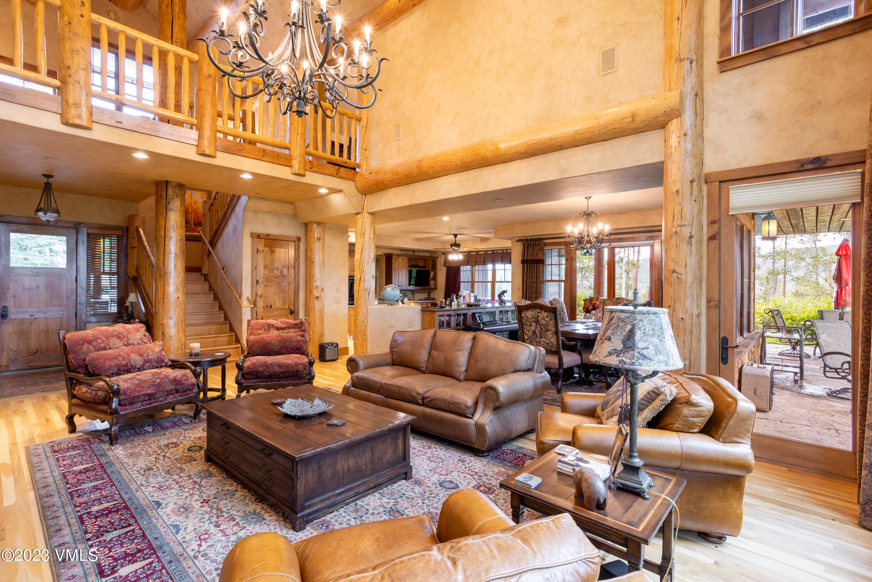 67 Cimarron Trail Edwards, CO 81632 - Photo 15 of 51 a living room with furniture a rug and a chandelier