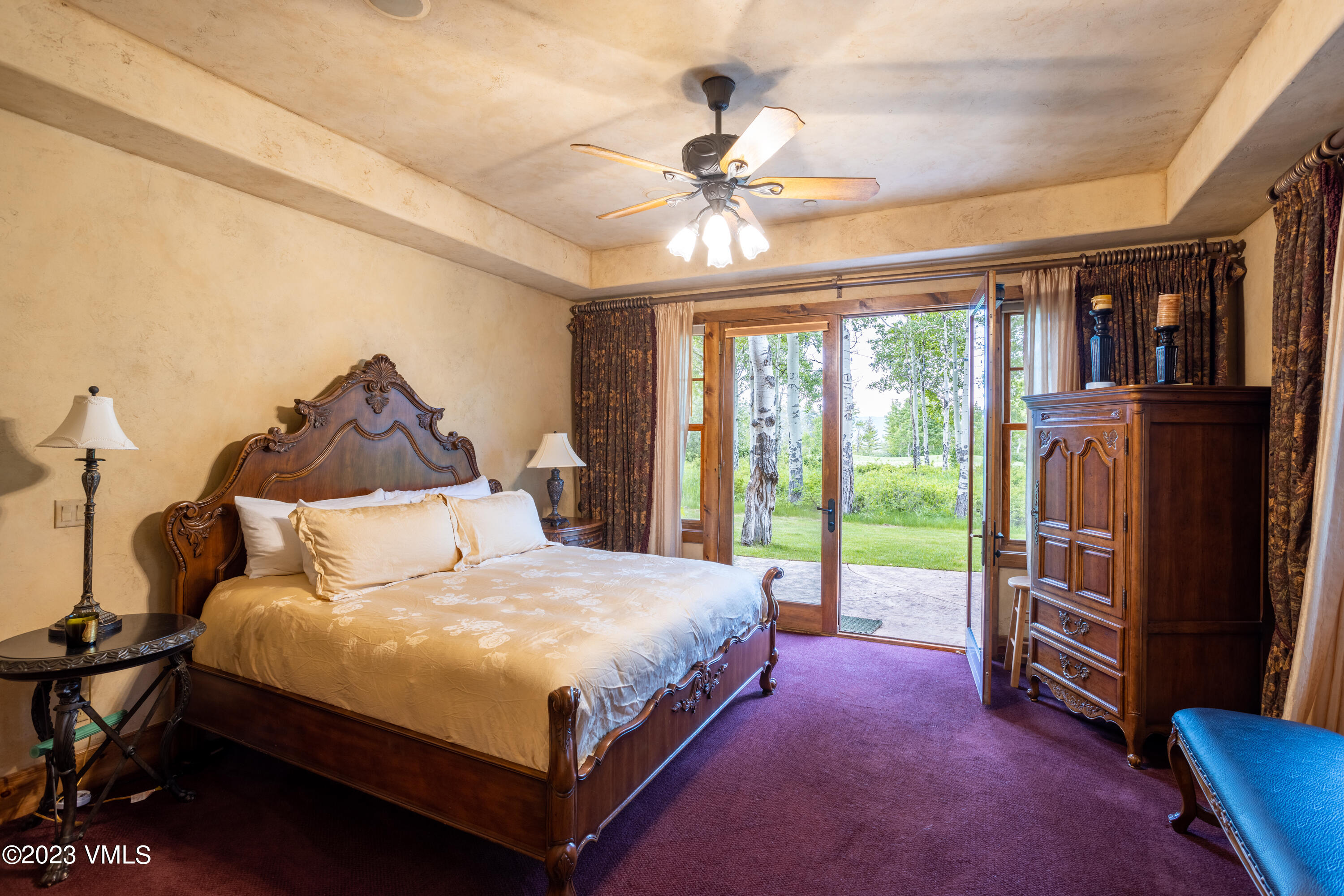 67 Cimarron Trail Edwards, CO 81632 - Photo 21 of 51 a bedroom with a bed and a chandelier