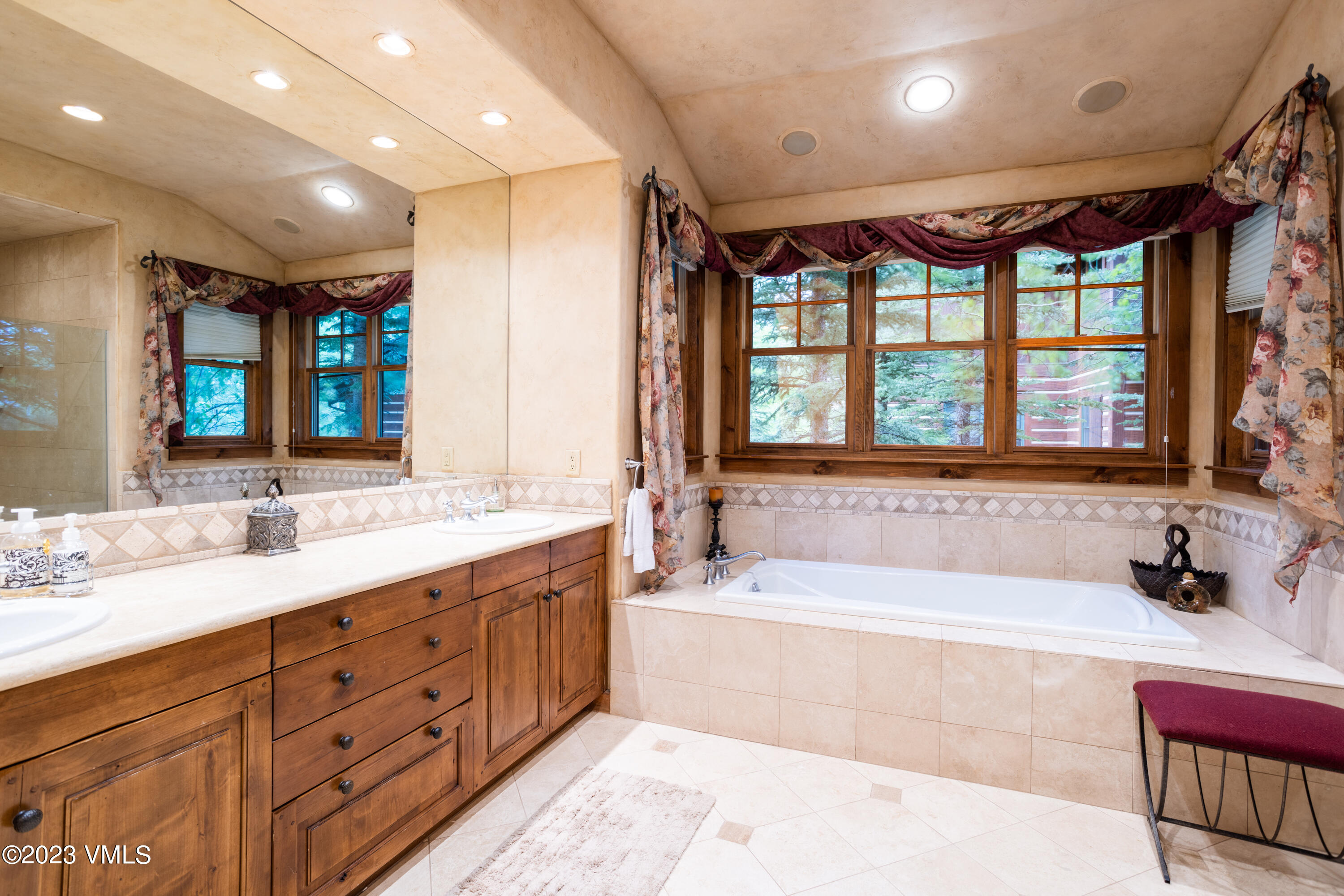 67 Cimarron Trail Edwards, CO 81632 - Photo 24 of 51 a spacious bathroom with a large tub sink and mirror