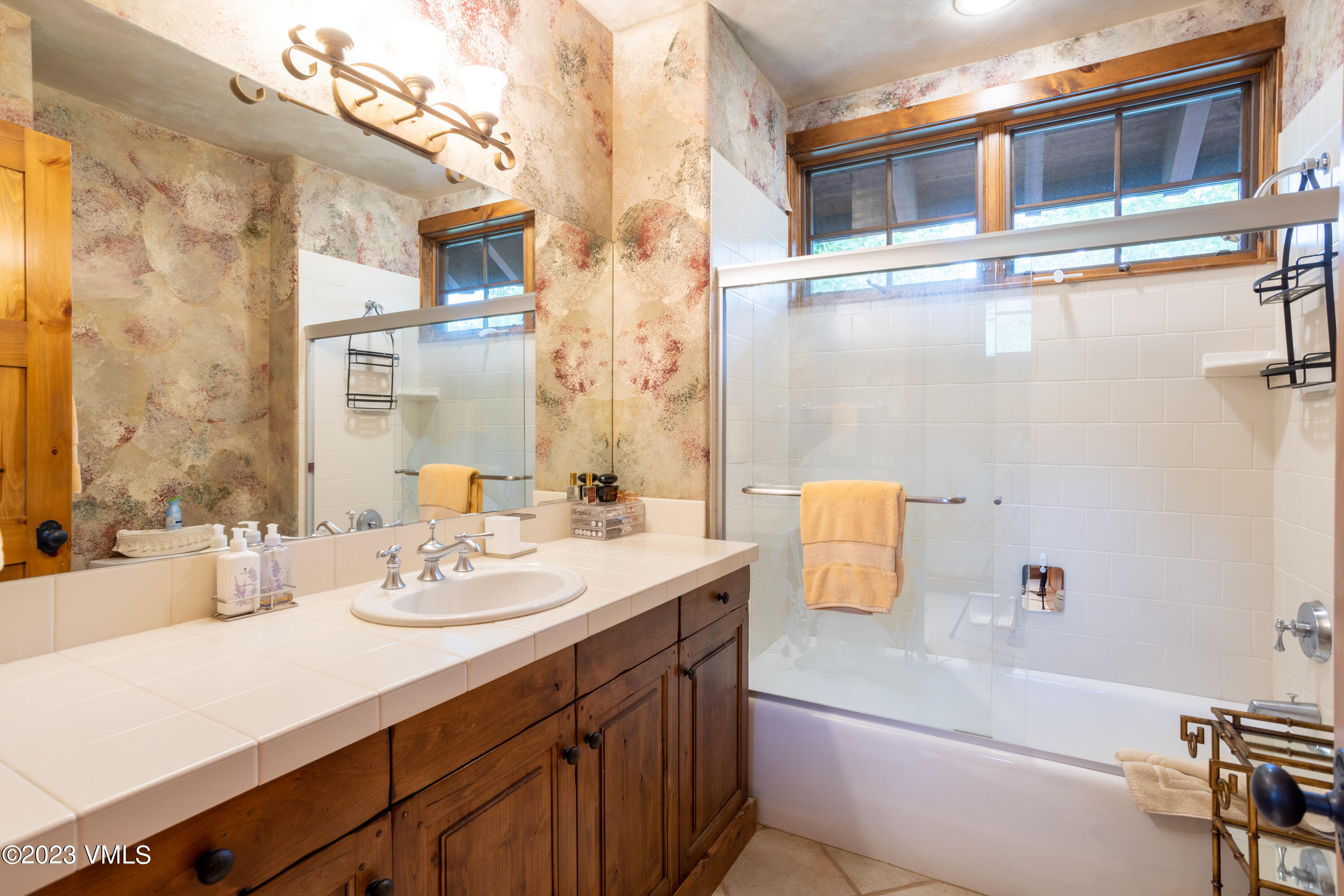 67 Cimarron Trail Edwards, CO 81632 - Photo 39 of 51 a bathroom with a sink a tub and a mirror