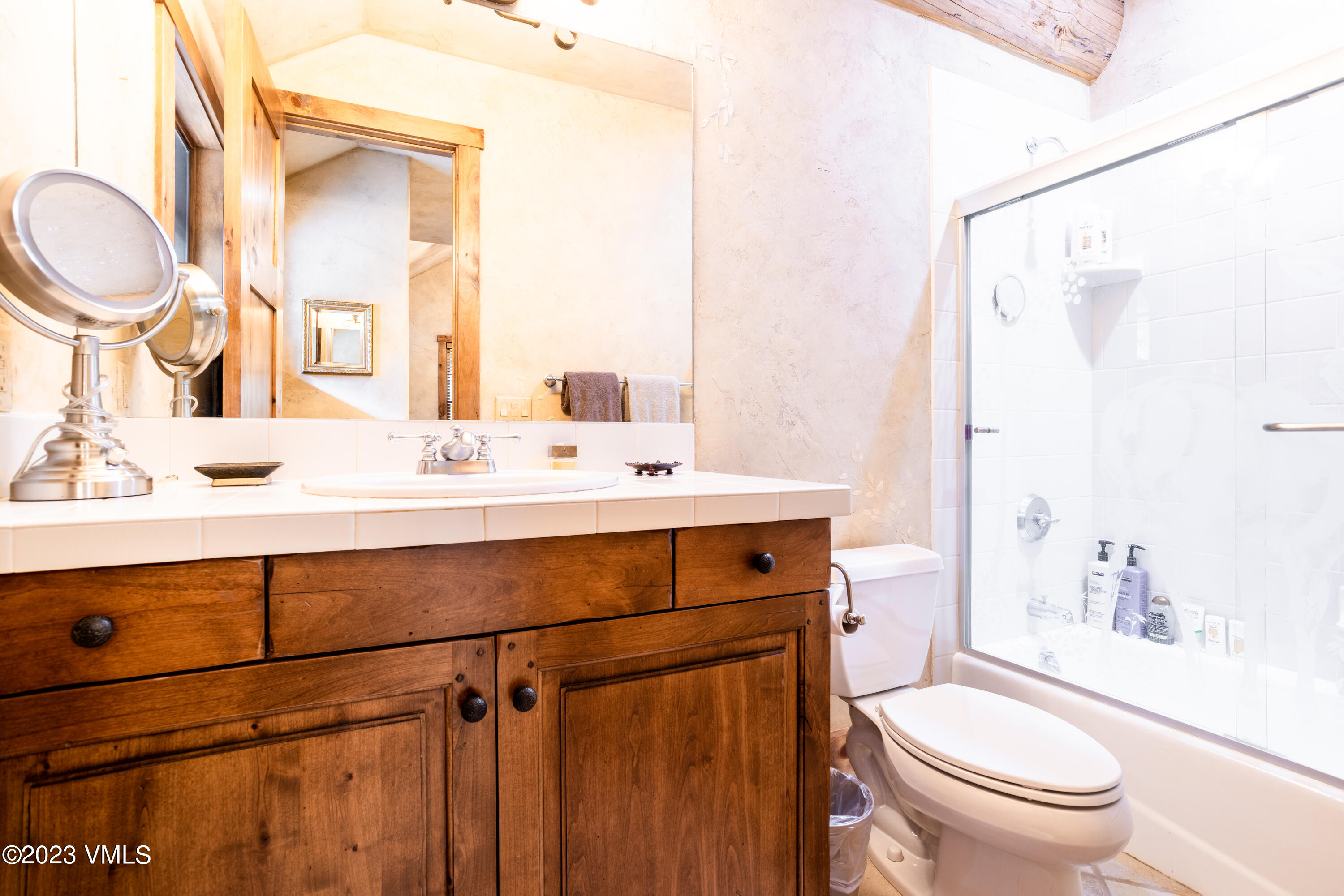 67 Cimarron Trail Edwards, CO 81632 - Photo 41 of 51 a bathroom with a sink a toilet and a mirror