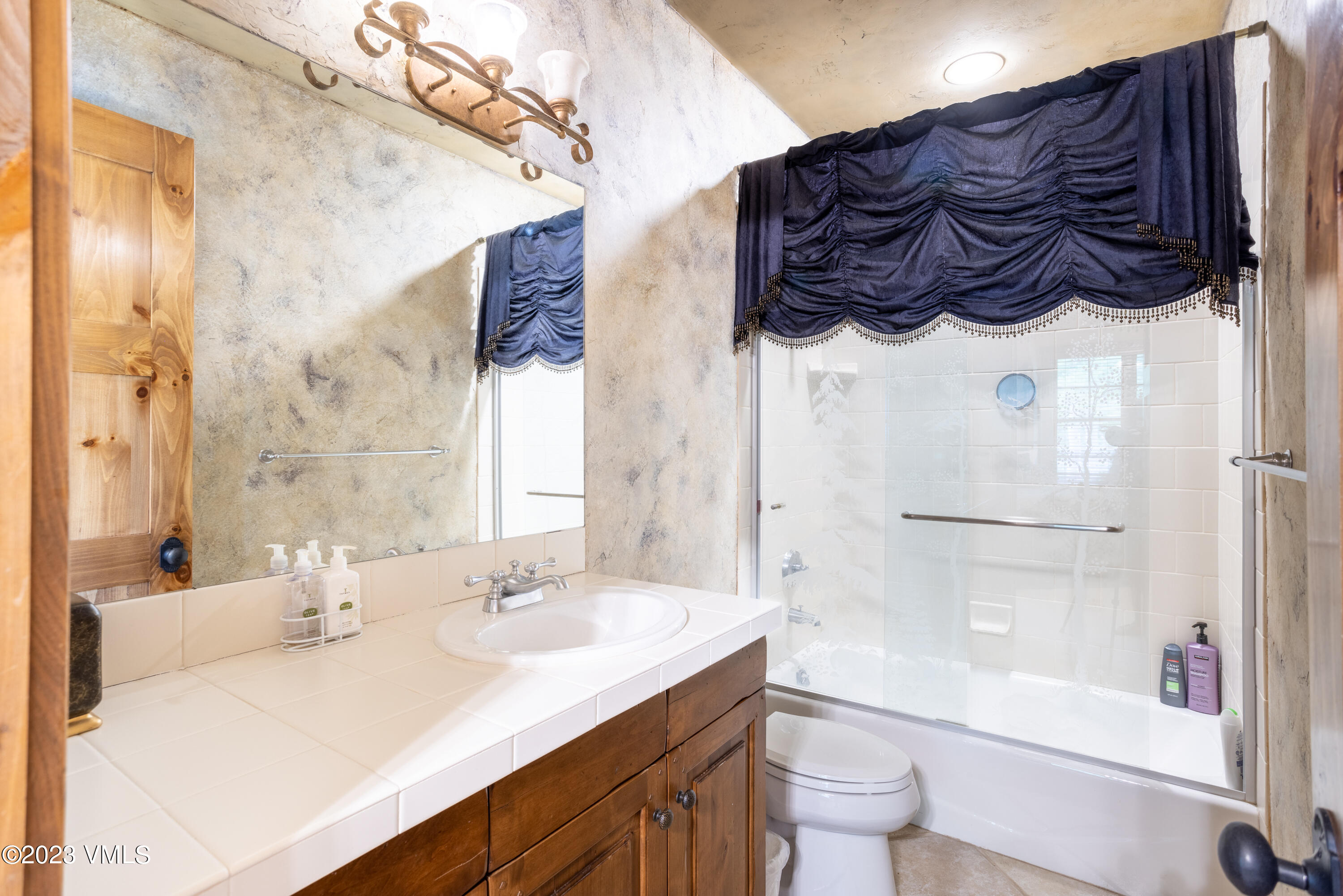 67 Cimarron Trail Edwards, CO 81632 - Photo 43 of 51 a bathroom with a sink a toilet and a mirror
