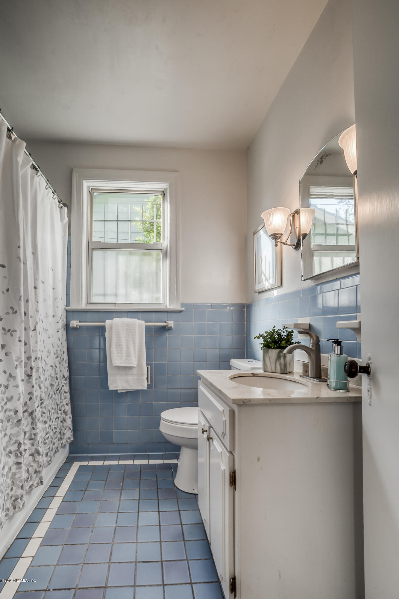 1024 Chatford Road Jacksonville, FL 32207 - Photo 14 of 22 a bathroom with a sink toilet and window