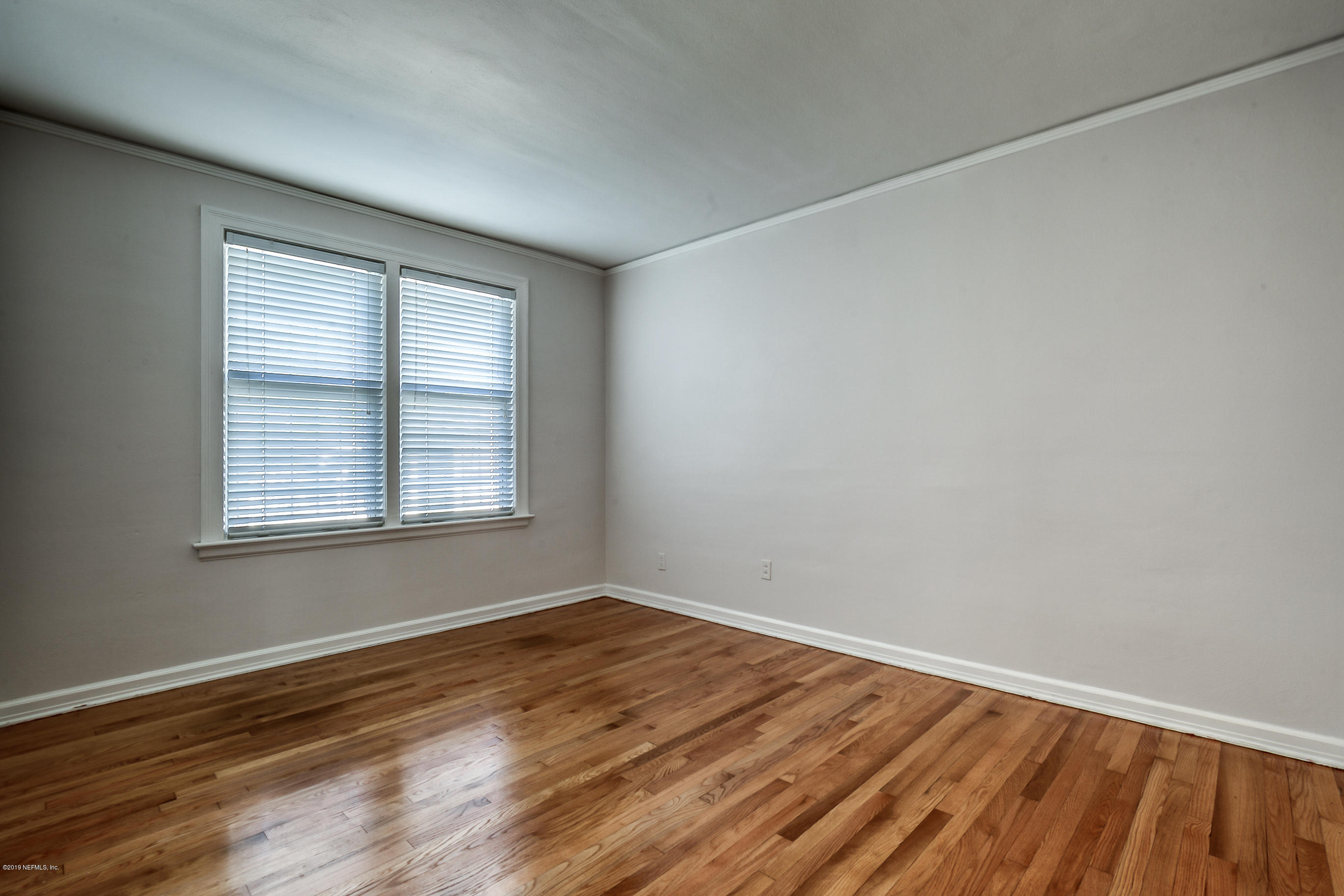 1024 Chatford Road Jacksonville, FL 32207 - Photo 16 of 22 wooden floor in an empty room with a window