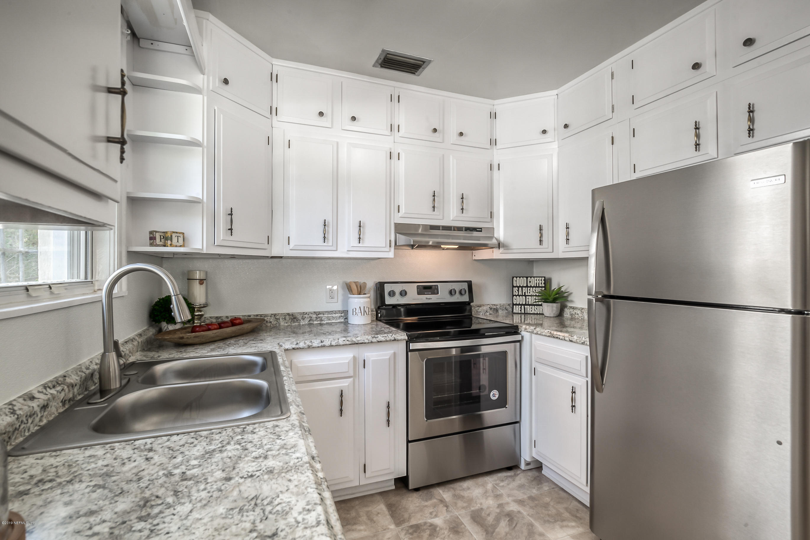 1024 Chatford Road Jacksonville, FL 32207 - Photo 3 of 22 a kitchen with stainless steel appliances granite countertop a sink stove and refrigerator