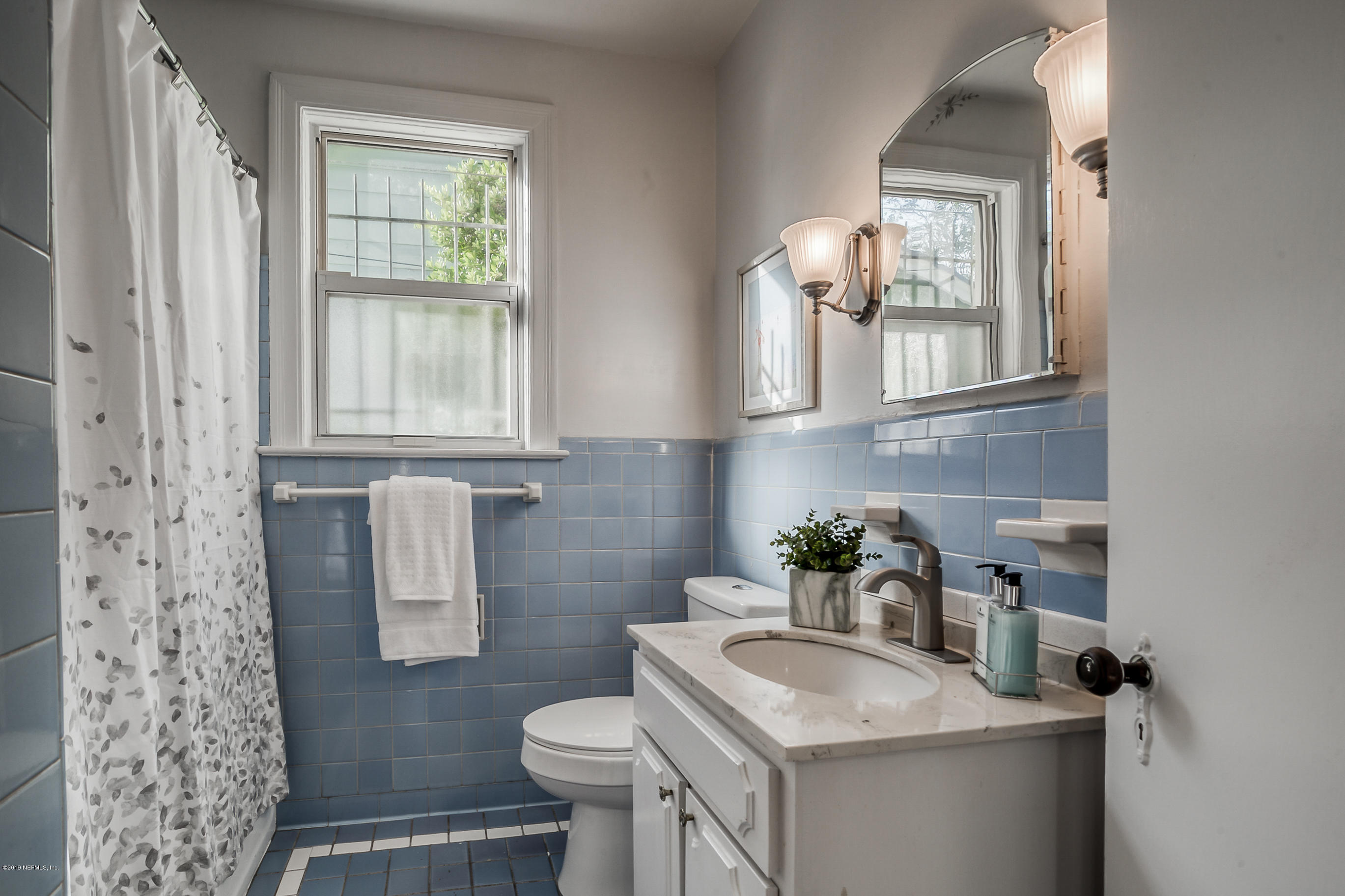 1024 Chatford Road Jacksonville, FL 32207 - Photo 6 of 22 a bathroom with a sink toilet and window