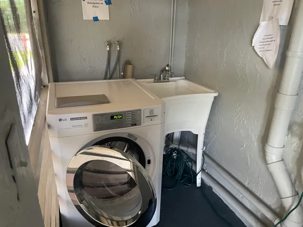 a utility room with dryer and washer