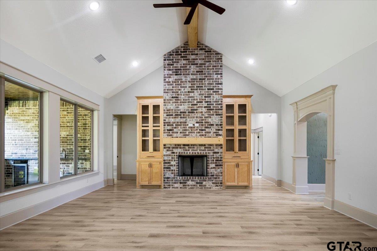 12336 Oak Grove Drive Lindale, TX 75706 - Photo 14 of 46 a living room with fireplace and wooden floor
