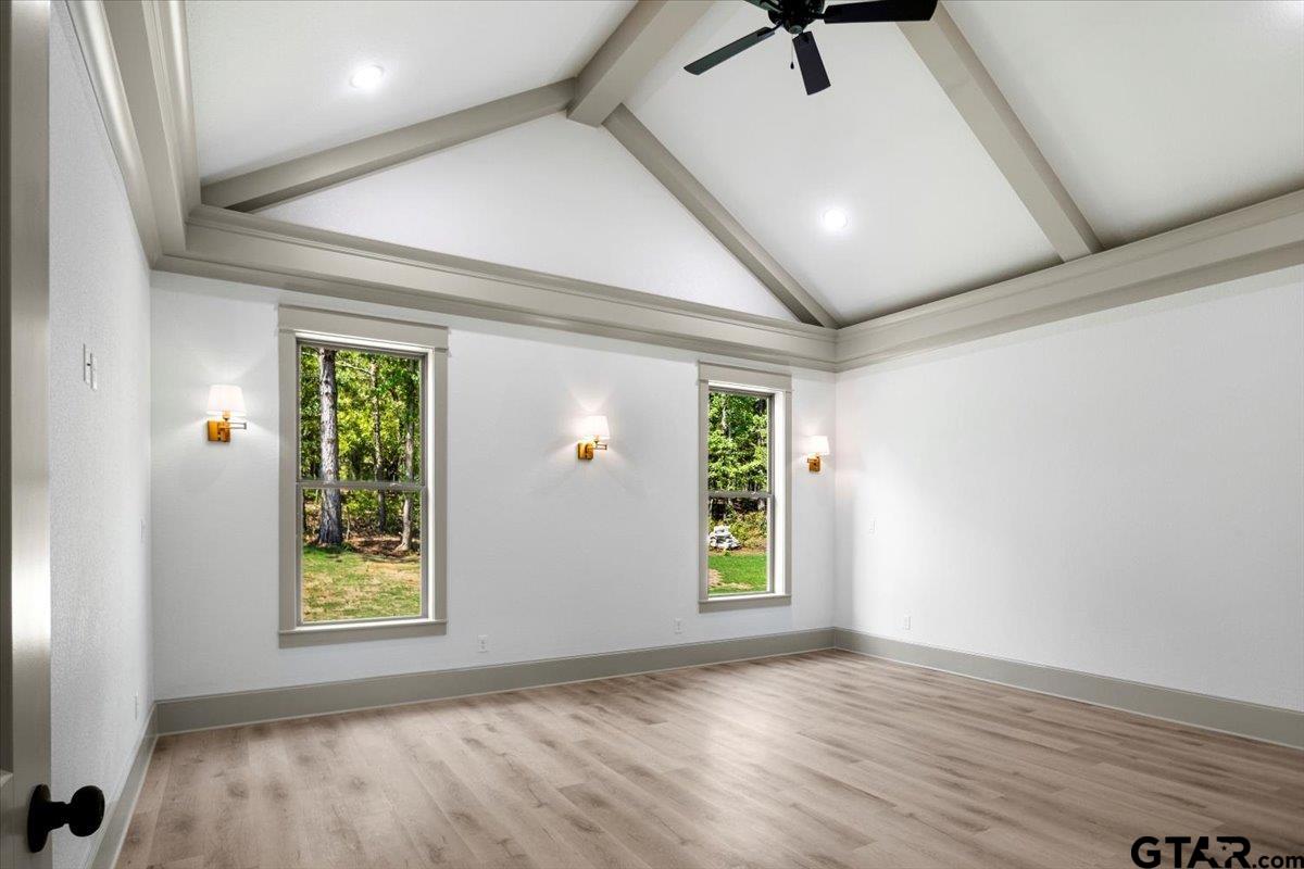 12336 Oak Grove Drive Lindale, TX 75706 - Photo 16 of 46 a view of an empty room with a window and wooden floor