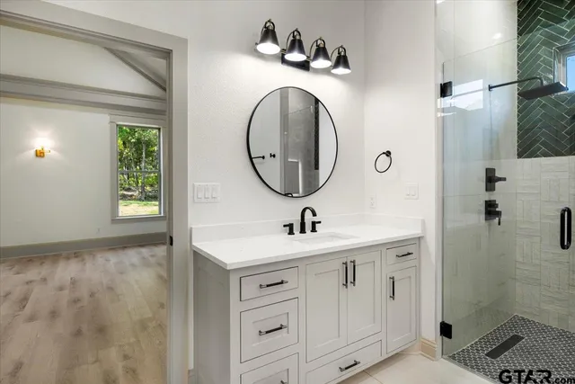 a bathroom with a sink and a mirror