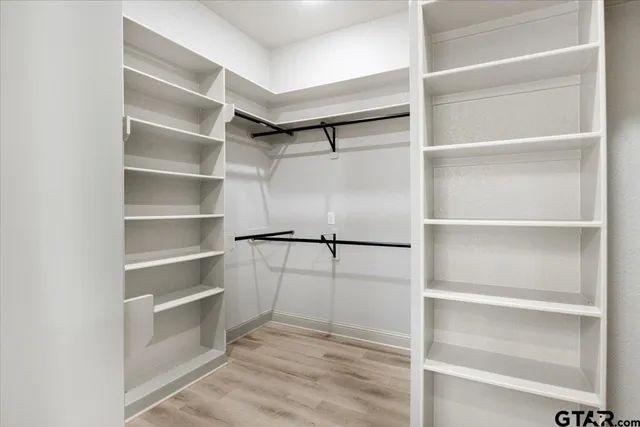 a view of an empty walk in closet