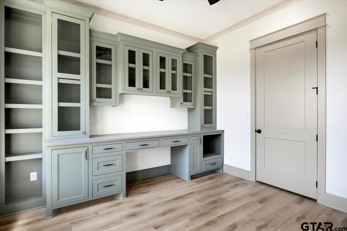 12336 Oak Grove Drive Lindale, TX 75706 - Photo 27 of 46 a view of cabinets a wooden floor and a window