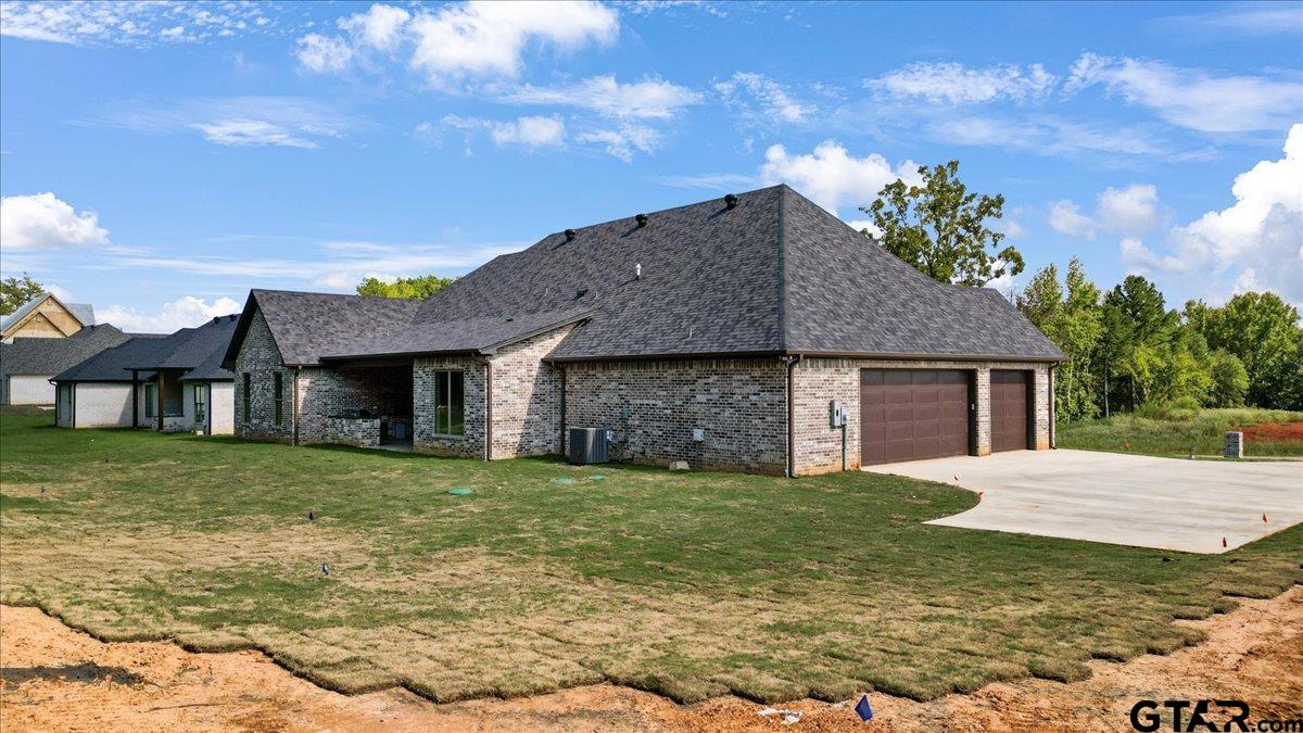 12336 Oak Grove Drive Lindale, TX 75706 - Photo 3 of 46 a front view of a house with a yard