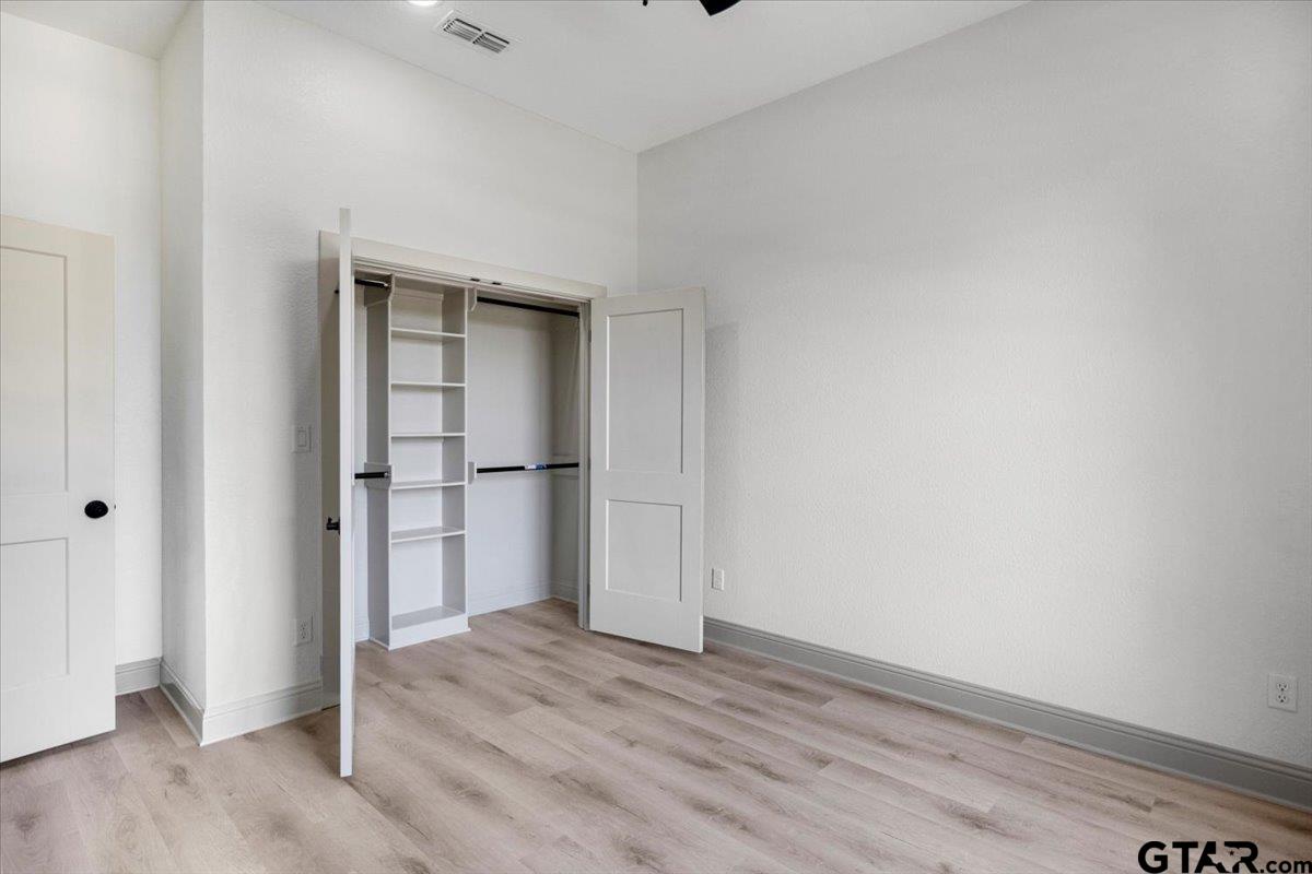 12336 Oak Grove Drive Lindale, TX 75706 - Photo 32 of 46 a view of empty room with wooden floor