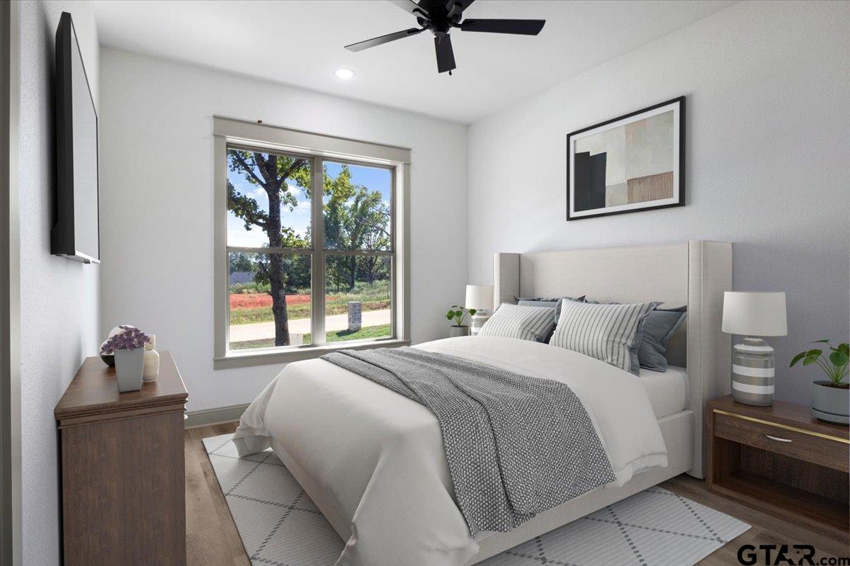 12336 Oak Grove Drive Lindale, TX 75706 - Photo 36 of 46 a bedroom with a bed and wooden floor