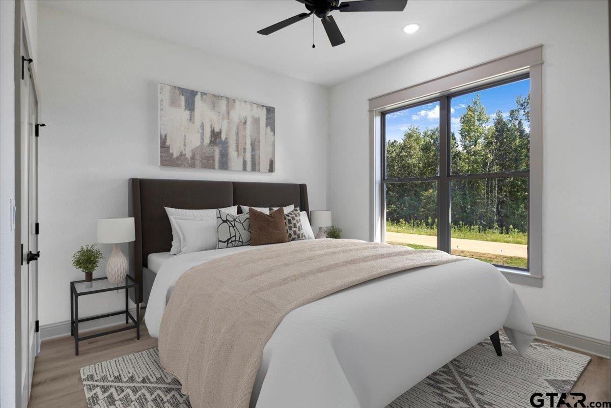 12336 Oak Grove Drive Lindale, TX 75706 - Photo 42 of 46 a bedroom with a large bed and a window