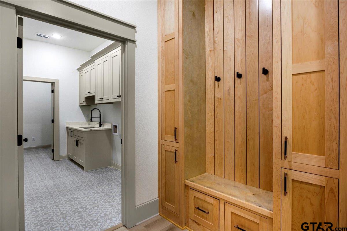 12336 Oak Grove Drive Lindale, TX 75706 - Photo 45 of 46 a view of a hallway with storage space