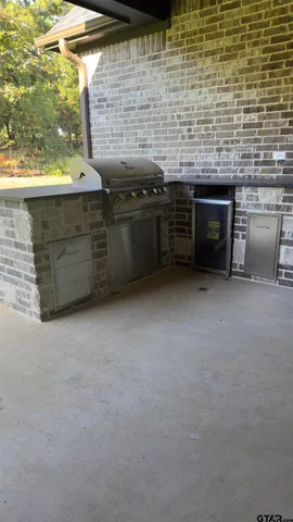 a view of an empty room with a fireplace