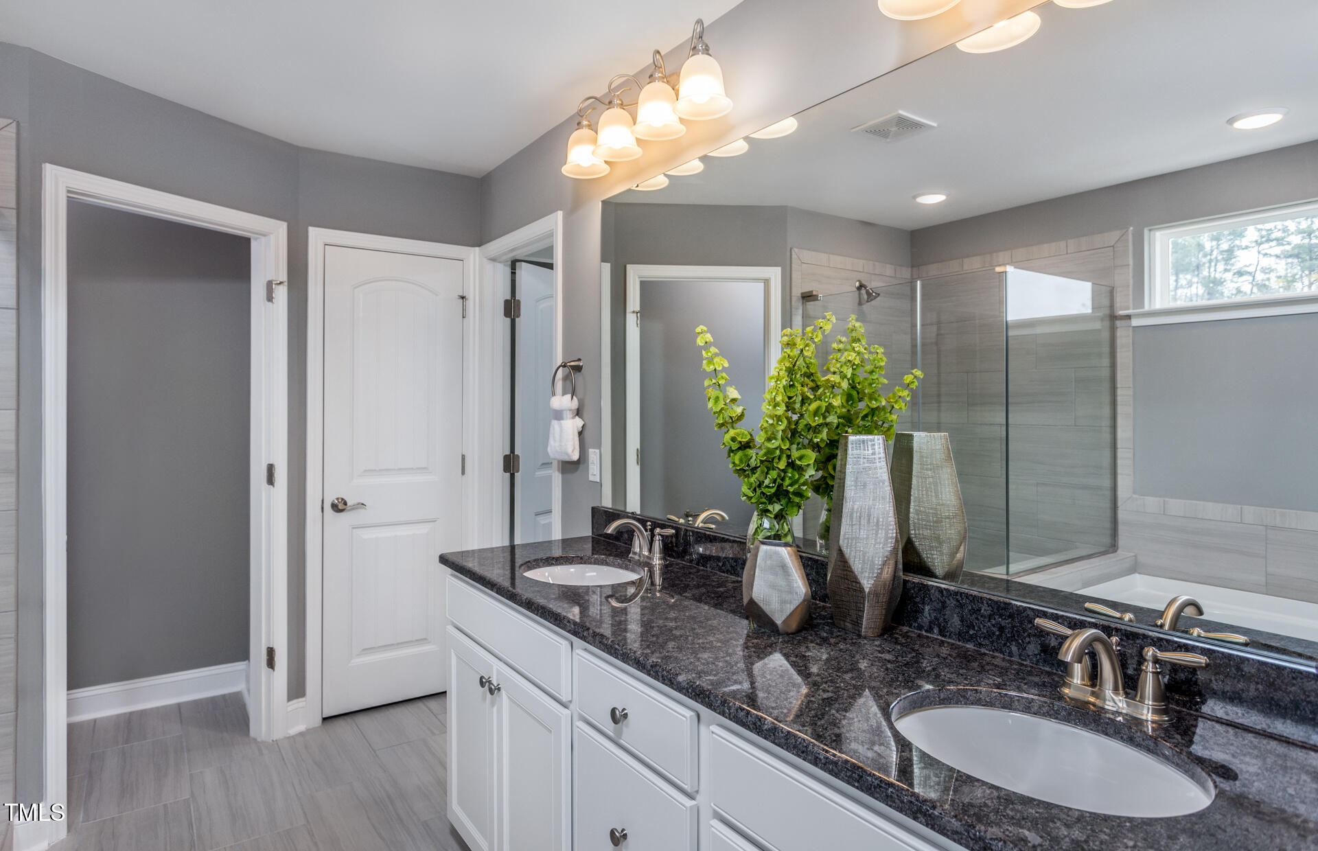 47 Rosedale Way Pittsboro, NC 27312 - Photo 12 of 15 a bathroom with a double vanity sink and a mirror